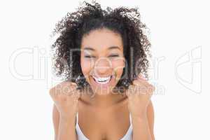 Pretty girl with afro hairstyle smiling at camera