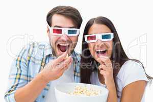 Attractive young couple watching a 3d movie