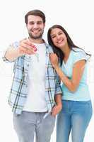 Happy young couple showing new house key