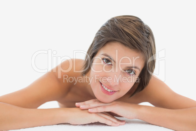 Close up portrait of a beautiful young woman on massage table