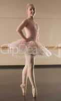 Beautiful ballerina standing en pointe