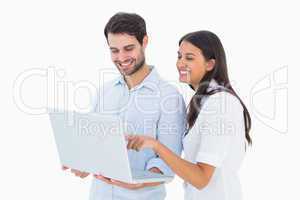 Attractive young couple holding their laptop