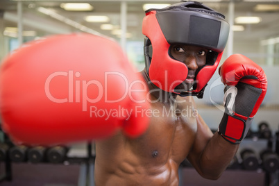 Male boxer attacking with his right