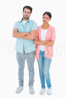 Serious couple with arms crossed