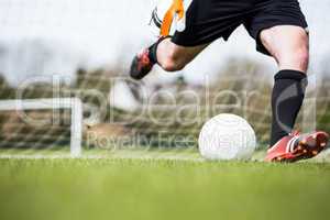 Goalkeeper kicking ball away from goal