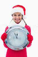 Beautiful festive woman holding clock