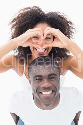 Attractive couple in matching clothes smiling at camera