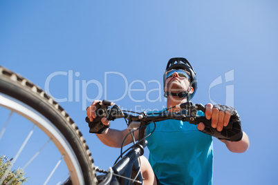 Fit cyclist riding on country trail