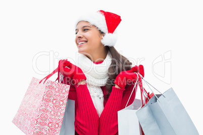 Beautiful festive woman holding shopping bags