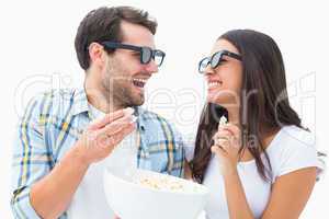 Attractive young couple watching a 3d movie