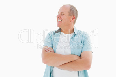 Happy older man with arms crossed