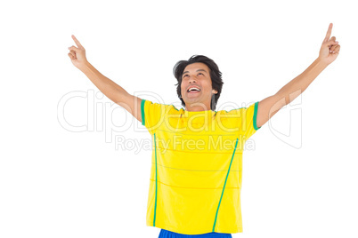 Football player in yellow celebrating a victory