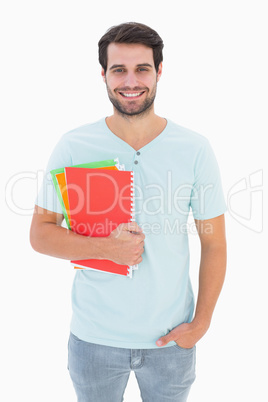 Handsome student smiling at camera