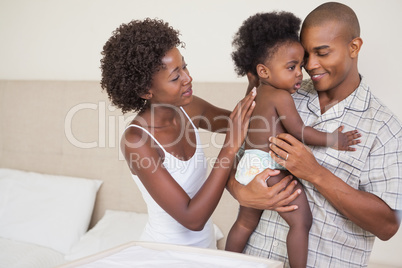 Happy parents with their baby girl