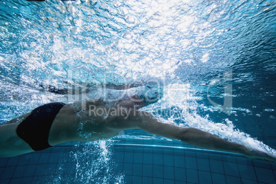 Fit swimmer training by himself