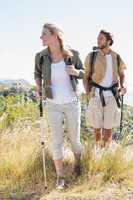 Hiking couple walking on mountain trail