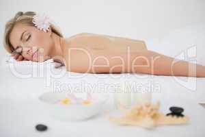 Beautiful blonde lying on massage table