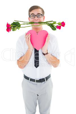 Geeky hipster holding red roses and heart card