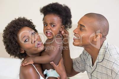 Happy parents with baby girl