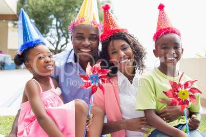 Happy family celebrating a birthday together in the garden