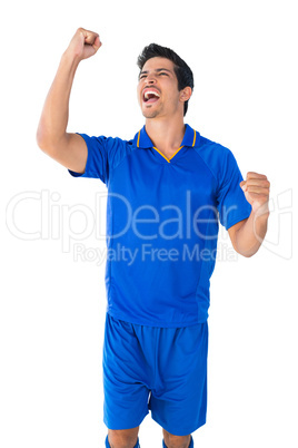 Happy football player in blue celebrating