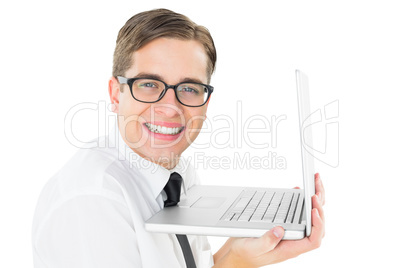 Geeky businessman holding his laptop