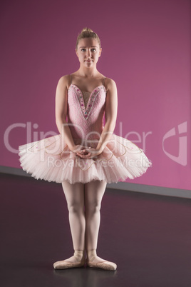 Graceful ballerina standing in first position