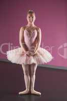 Graceful ballerina standing in first position
