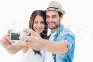Happy hipster couple taking a selfie