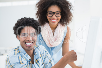 Young design team working together at desk