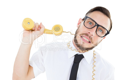 Geeky businessman being strangled by phone cord