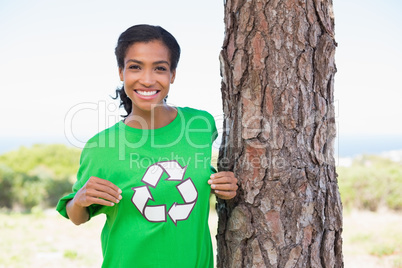 Pretty environmental activist showing her t-shirt
