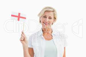 Happy mature woman holding english flag