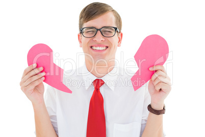 Geeky hipster holding a broken heart card