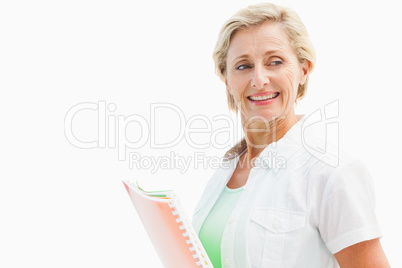 Happy mature student holding notebooks
