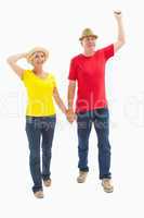 Mature couple walking and holding hands