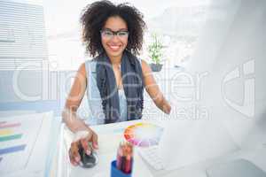 Pretty designer working at her desk