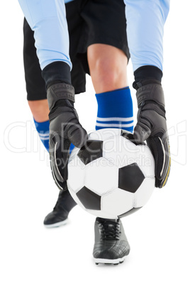 Goalkeeper picking up the ball