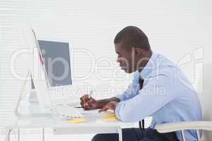 Focused businessman sitting at his desk working