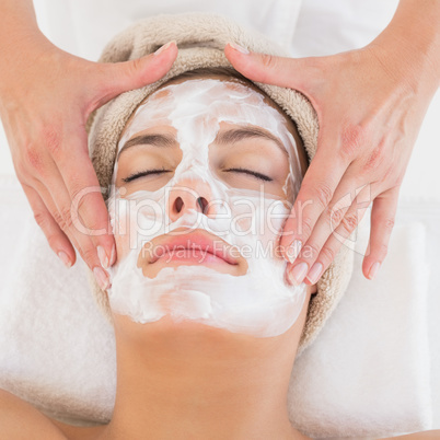 Attractive woman receiving treatment at spa center