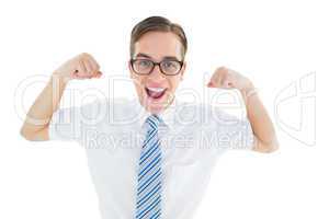 Geeky happy businessman flexing biceps