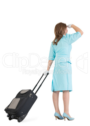 Stewardess in blue uniform with her bag