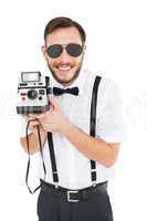 Geeky hipster holding a retro camera