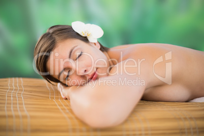 Beautiful young woman on massage table