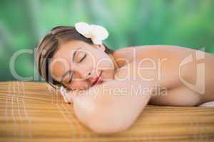 Beautiful young woman on massage table