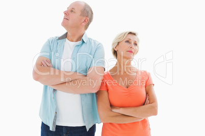 Thinking older couple with arms crossed