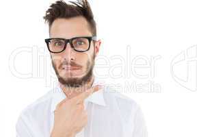 Geeky young businessman looking at camera and pointing