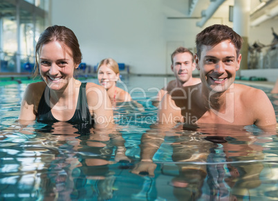 Fitness class using underwater exercise bikes