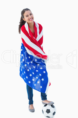 Pretty brunette wearing the american flag with football