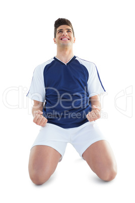 Football player in blue celebrating Football player in blue celebrating